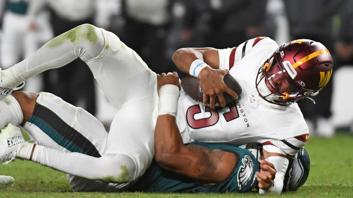Philadelphia Eagles linebacker Nolan Smith Jr. (3) sacks Washington Commanders quarterback Jayden Daniels (5) during the third quarter at Lincoln Financial Field.
