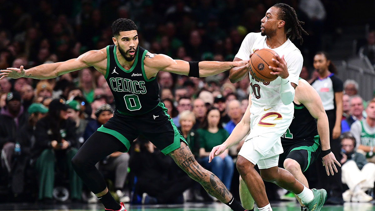  Boston Celtics forward Jayson Tatum (0) defends Cleveland Cavaliers guard Darius Garland (10) during the first half at TD Garden.