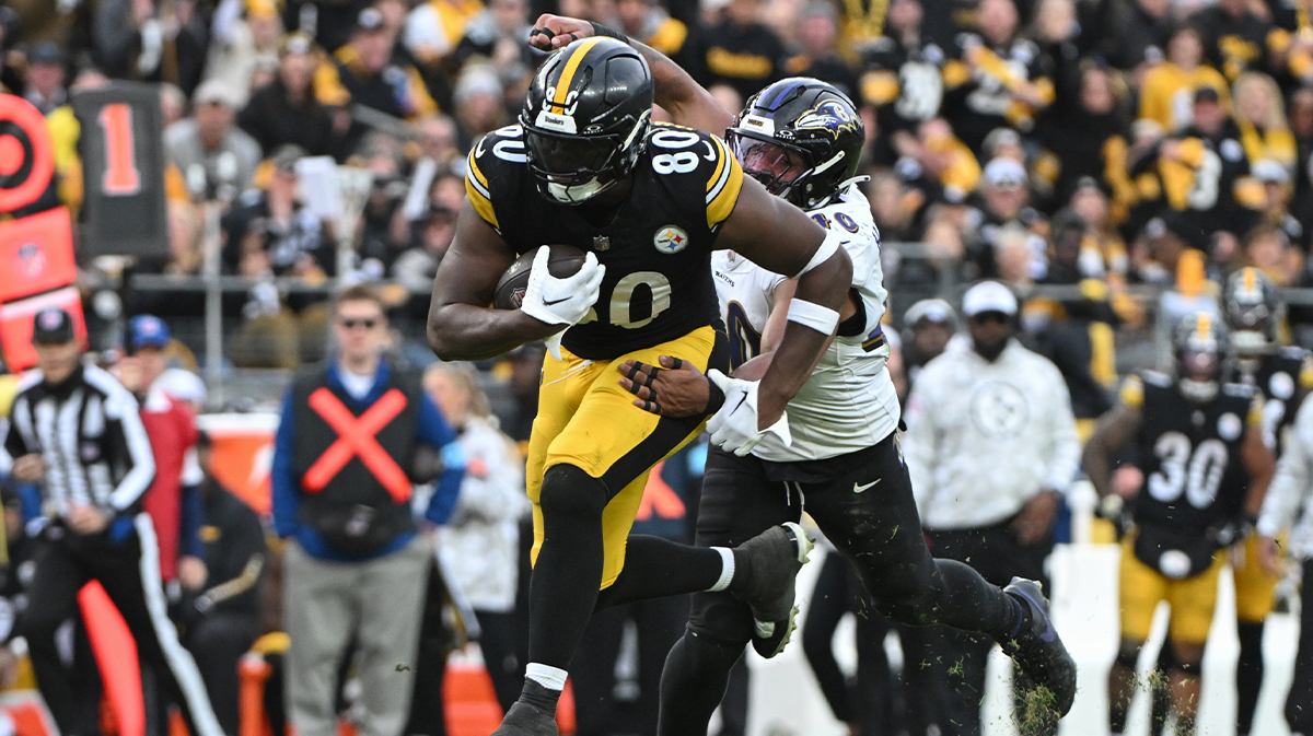 Pittsburgh Steelers tight end Darnell Washington (80) runs for extra yardage while being chased by Baltimore Ravens linebacker Malik Harrison (40) during the fourth quarter at Acrisure Stadium. Darnell Washington was also involved when the Steelers found a snake in their locker room before their Week 10 Commanders game.