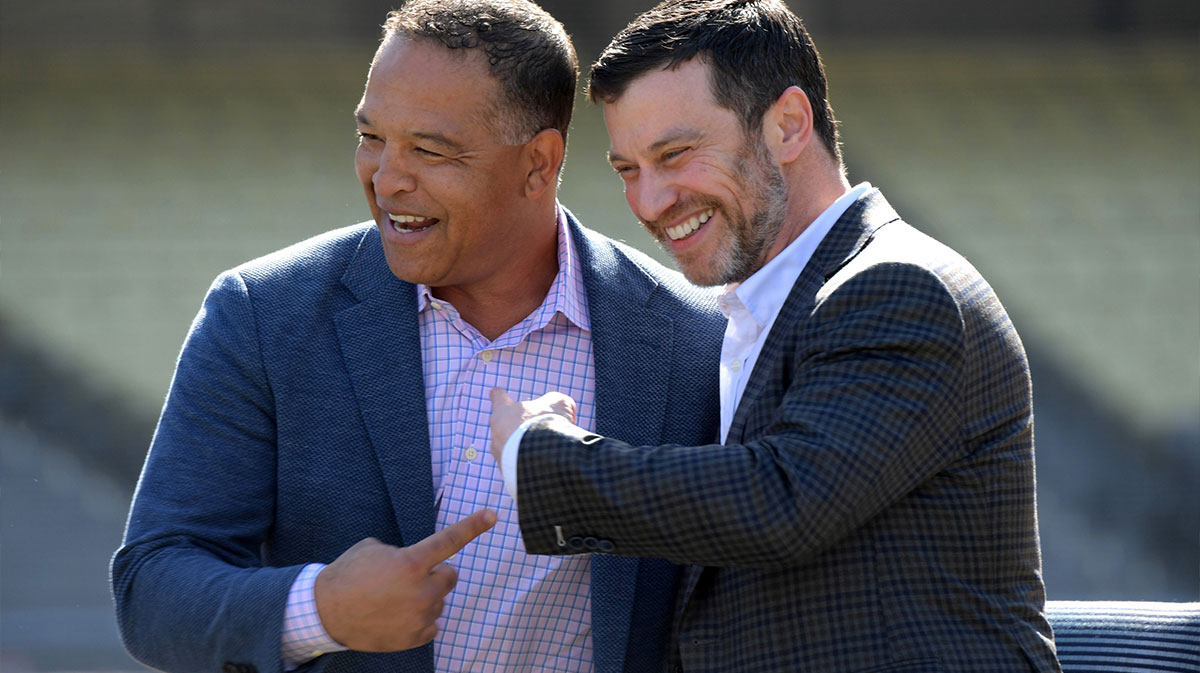 Los Angeles Dodgers manager Dave Roberts (left) and president of baseball operations Andrew Friedman react during a press conference at Dodger Stadium.