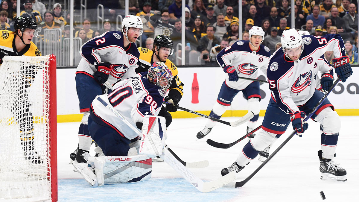 Columbus Blue Jackets defenseman David Jiricek (55) looks for a rebound in front of goaltender Elvis Merzlikins (90) during the first period against the Boston Bruins at TD Garden