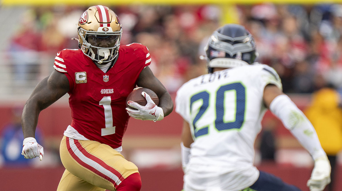 San Francisco 49ers wide receiver Deebo Samuel Sr. (1) runs the football against Seattle Seahawks safety Julian Love (20) during the fourth quarter at Levi's Stadium. 