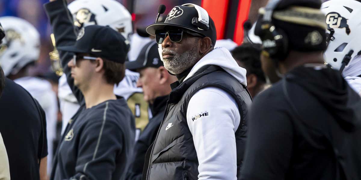 Deion Sanders watches the run of play during the 2nd quarter between the Kansas Jayhawks and the Colorado Buffaloes
