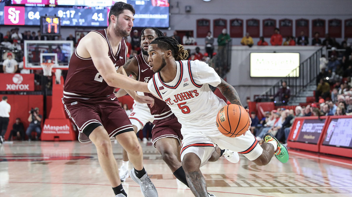 St. John's Red Storm guard Deivon Smith (5) drives past Fordham Rams forward Matt Zona (24) in the second half at Carnesecca Arena.