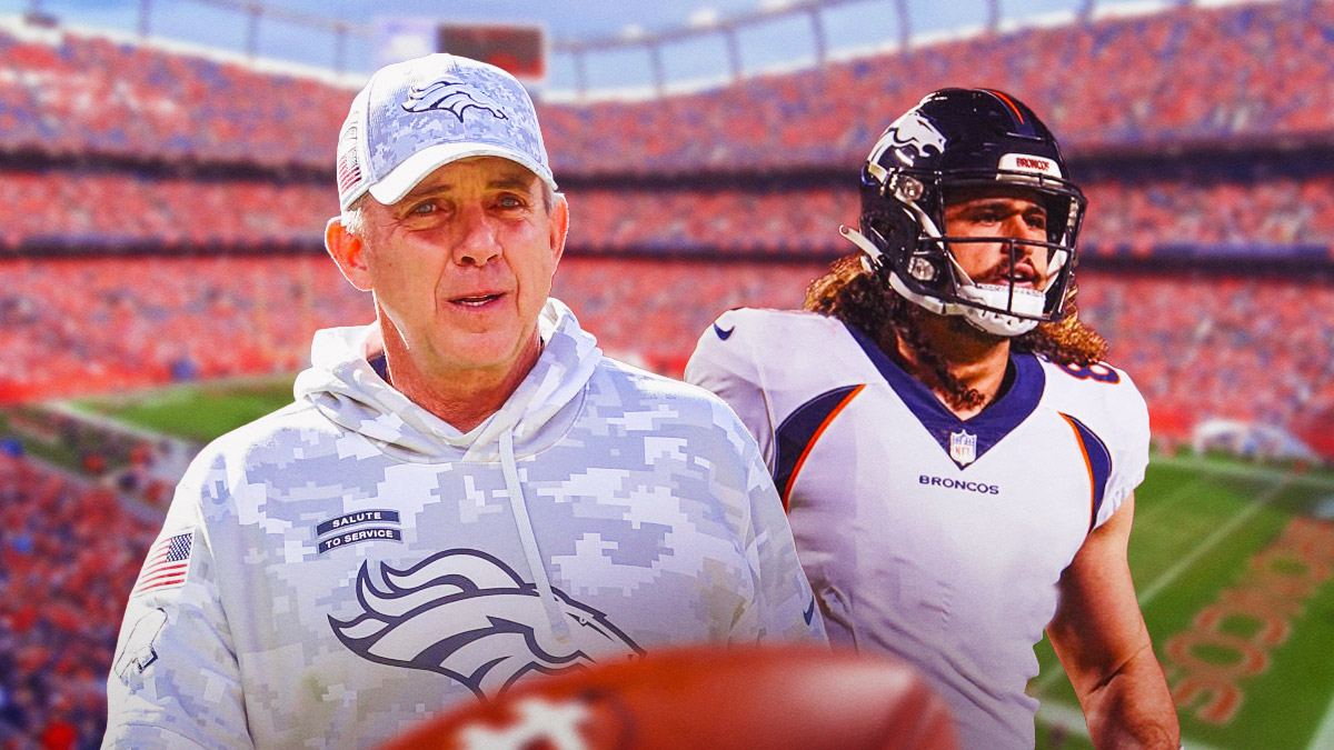 Greg Dulcich with no number on his jersey next to Sean Payton in front of the Broncos stadium