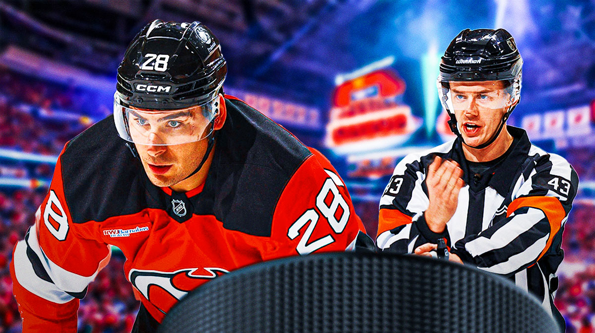 Devils forward Timo Meier inside Prudential Center next to a referee calling a penalty