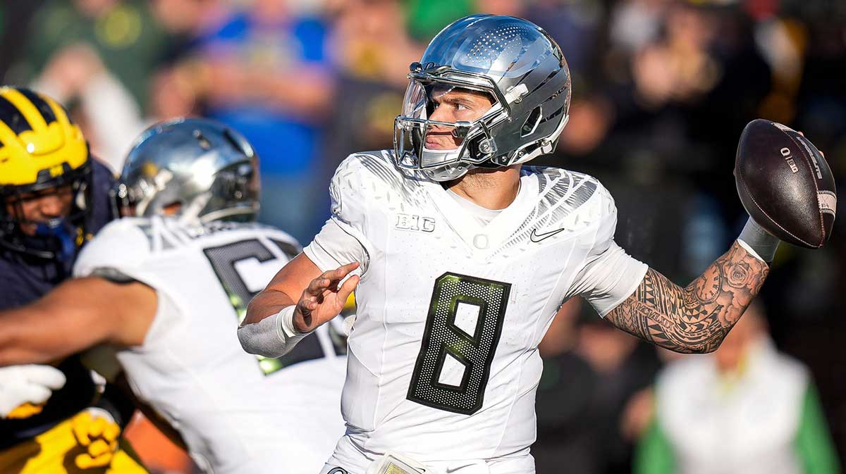 Oregon quarterback Dillon Gabriel makes a pass against Michigan during the first half