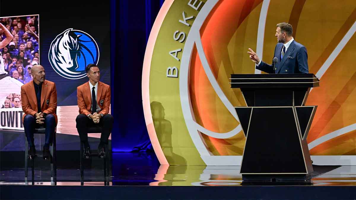 Aug 12, 2023; Springfield, MA, USA; Dirk Nowitzki addresses his presenters Steve Nash ('18), and Jason Kidd ('18) (L to R), during his speech as he is inducted into the 2023 Basketball Hall of Fame at Symphony Hall.
