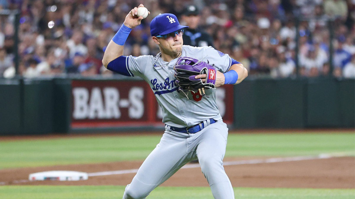 Los Angeles Dodgers infielder Kike Hernandez throws to first on a bunt at Chase Field on Aug. 31, 2024, in Phoenix.