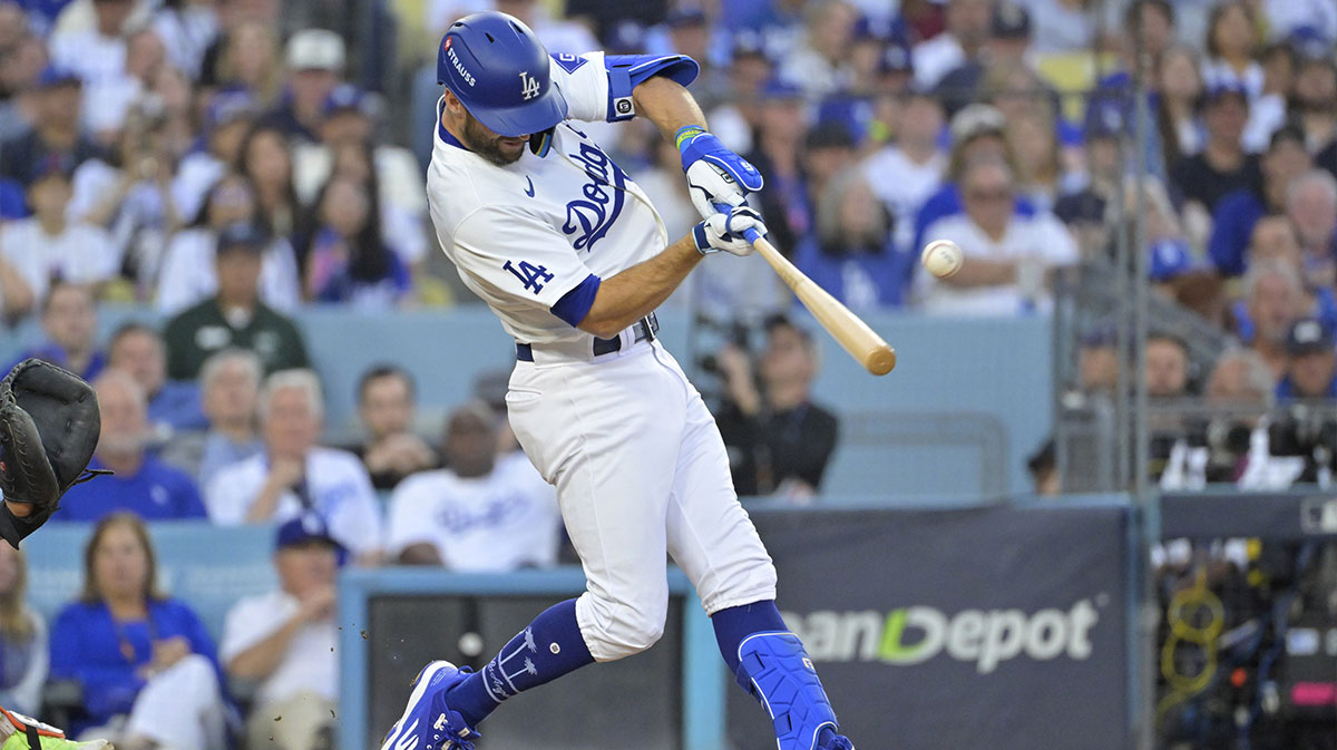 Los Angeles Dodgers second baseman Chris Taylor (3) hits a double in the second inning against the New York Mets during game six of the NLCS for the 2024 MLB playoffs at Dodger Stadium.