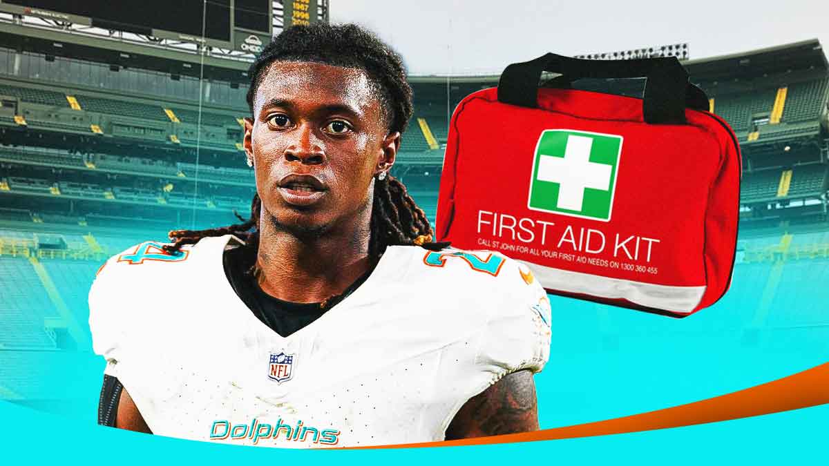 Dolphins CB Cam Smith with medical kit next to him