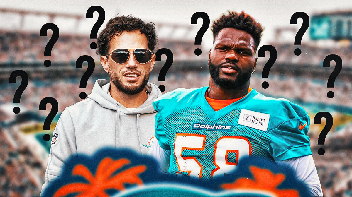 Dolphins head coach Mike McDaniel standing next to Shaq Barrett with question marks