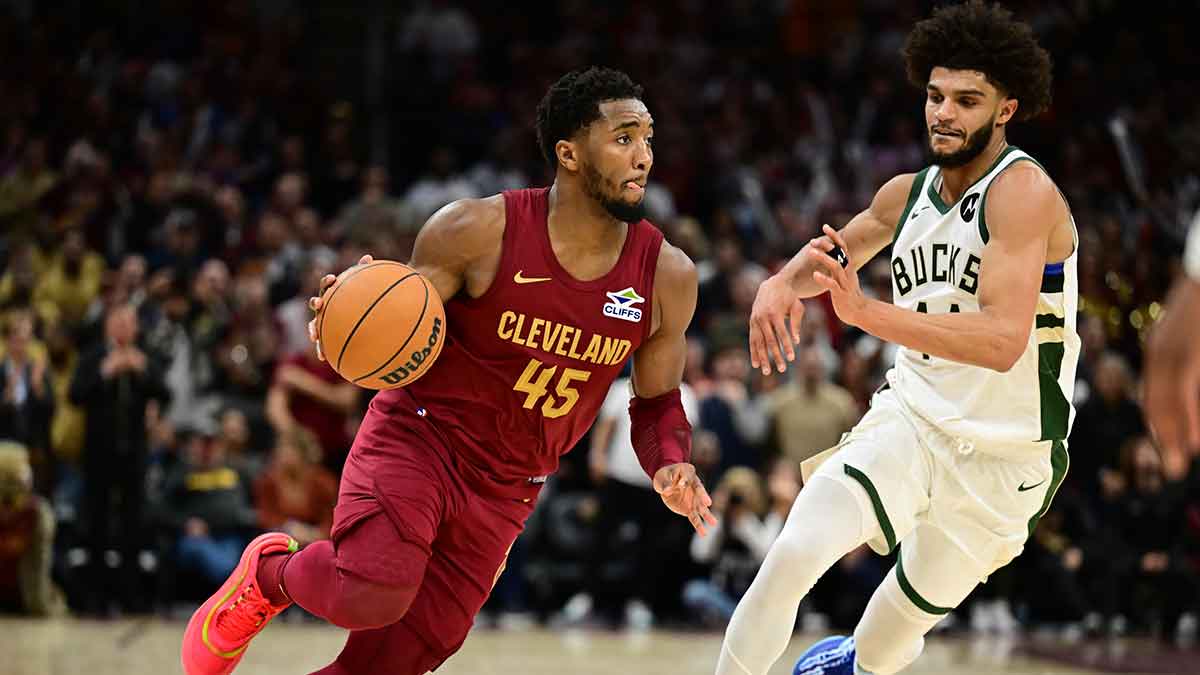 Cleveland Cavaliers guard Donovan Mitchell (45) drives to the basket against Milwaukee Bucks guard Andre Jackson Jr. (44) during the second half at Rocket Mortgage FieldHouse.