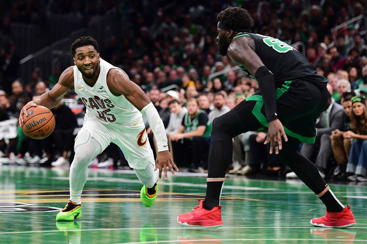 Cleveland Cavaliers guard Donovan Mitchell (45) controls the ball while Boston Celtics center Neemias Queta (88) defends during the second half at TD Garden.