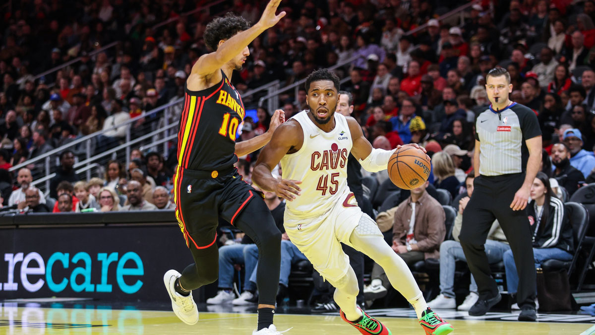 Cleveland Cavaliers guard Donovan Mitchell (45) drives the ball to the basket against Atlanta Hawks forward Zaccharie Risacher (10) during the fourth quarter at State Farm Arena.