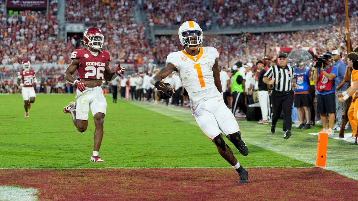 Tennessee Volunteers wide receiver Dont'e Thornton Jr. (1) scores a touchdown in front of Oklahoma Sooners defensive back Kani Walker (26) during a college football game between the University of Oklahoma Sooners (OU) and the Tennessee Volunteers at Gaylord Family - Oklahoma Memorial Stadium in Norman, Okla., Saturday, Sept. 21, 2024.