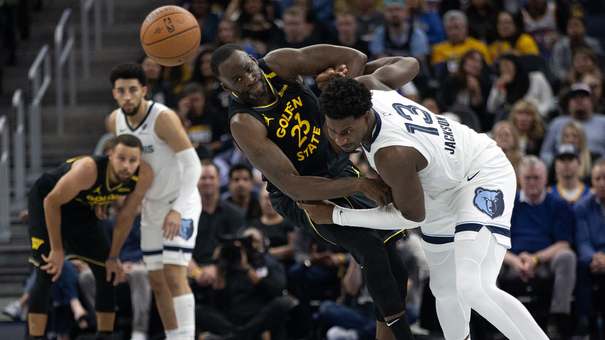 Nov 15, 2024; San Francisco, California, USA; Golden State Warriors forward Draymond Green (23) and Memphis Grizzlies forward Jaren Jackson Jr. (13) get tangled up pursuing a loose ball during the second quarter at Chase Center. Mandatory Credit: D. Ross Cameron-Imagn Images