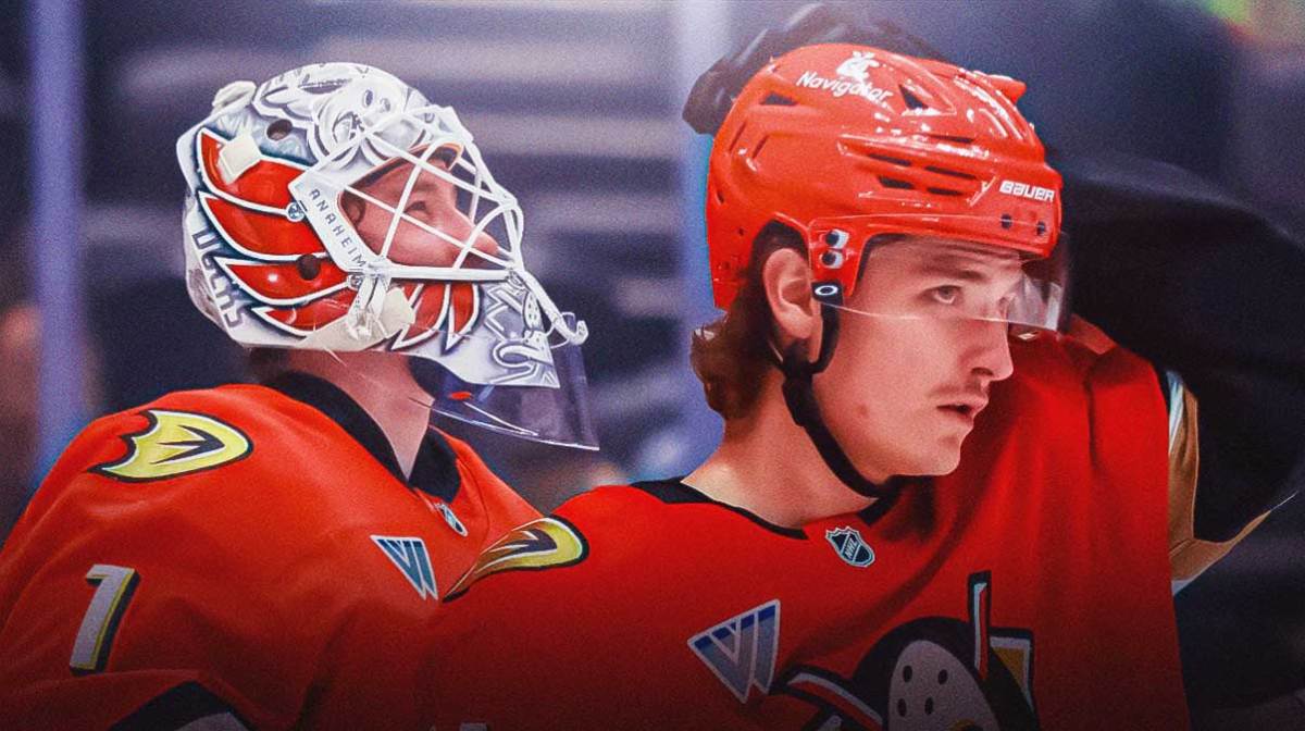 Ducks forward Trevor Zegras and goaltender Lucas Dostal inside Honda Center (both in new all-orange Ducks uniforms)