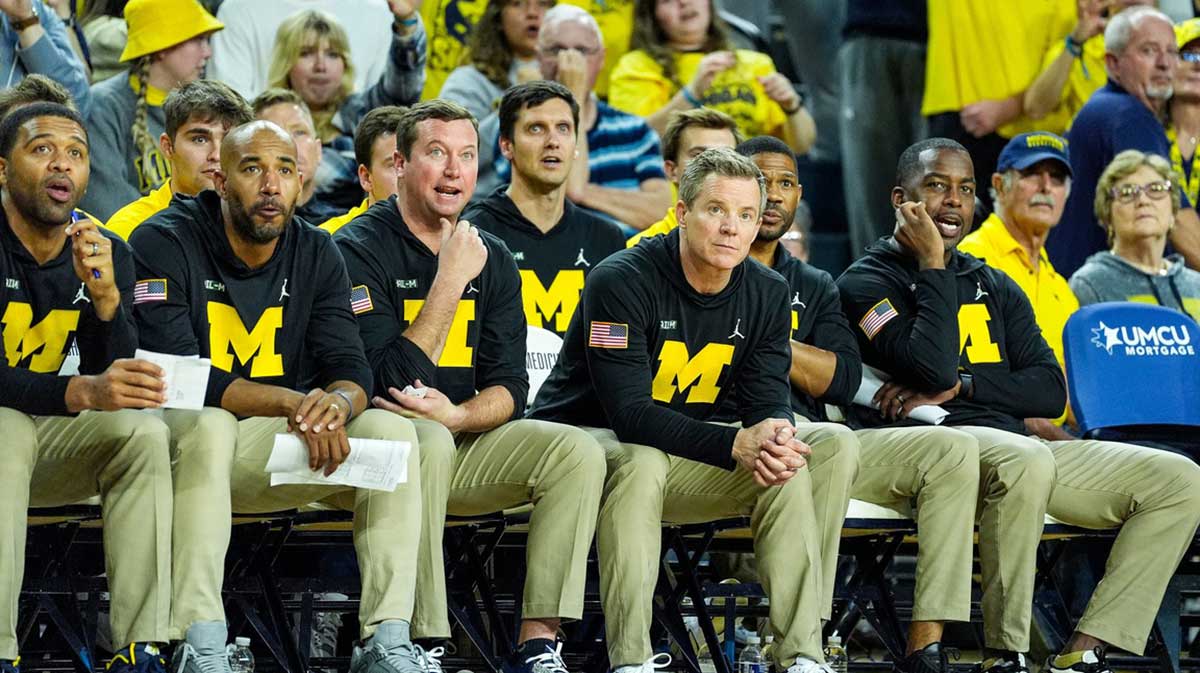 From left, Michigan assistant coach/Director of Player Development Drew Williamson, assistant coach Justin Joyner, assistant coach/general manager Kyle Church, head coach Dusty May, assistant coach Akeem Miskdeen and assistant coach Mike Boynton Jr. watch a play against Cleveland State during the second half at Crisler Center