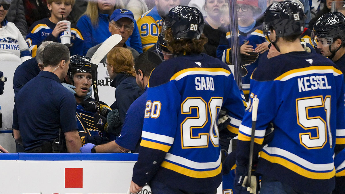 St. Louis Blues center Dylan Holloway (81) is checked on by a trainer after he came off the ice from a shift against the Tampa Bay Lightning during the first period at Enterprise Center. Dylan Holloway was removed from the bench on a stretcher