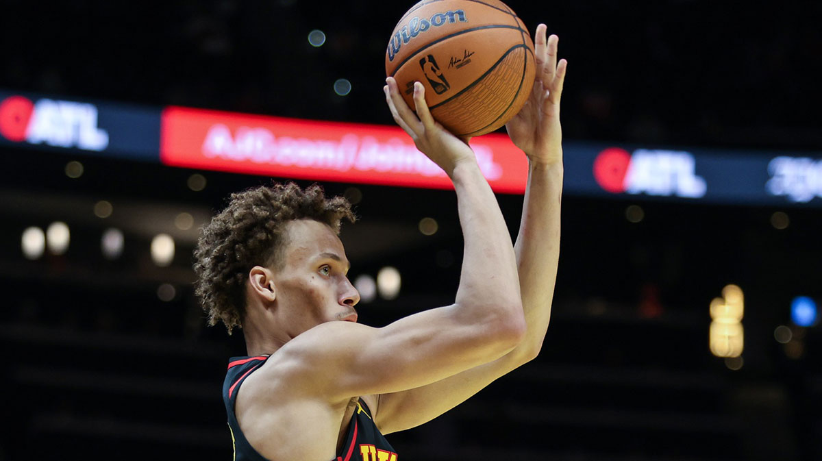 Atlanta Hawks guard Dyson Daniels (5) takes a three point shot against the Washington Wizards during the fourth quarter at State Farm Arena. 