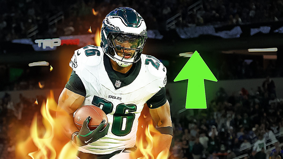 Photo: Saquon Barkley in action in Eagles jersey with arrows pointing up beside him, fire around him too