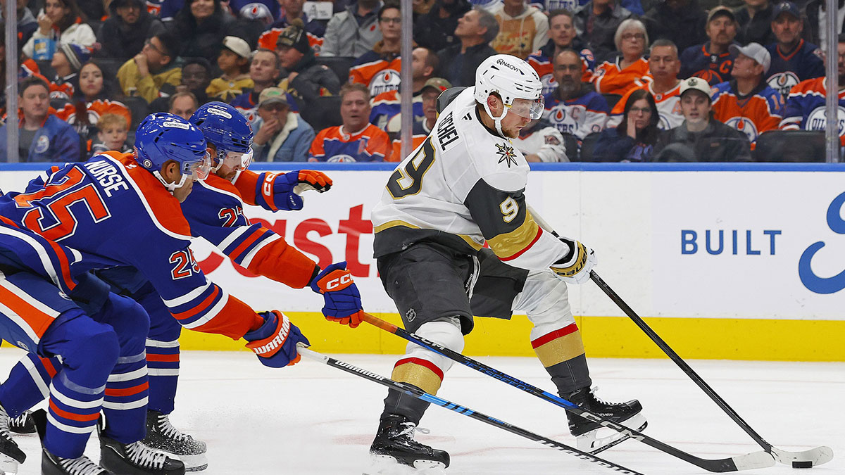 Vegas Golden Knights forward Jack Eichel (9) looks to make a pass past Edmonton Oilers defenseman Darnell Nurse (25) and defenseman Brett Kulak (27) during the second period at Rogers Place.