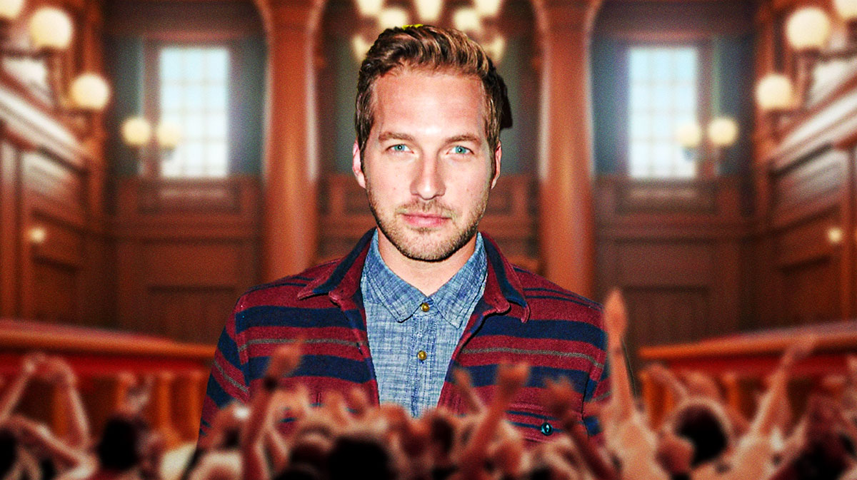 Night Court Season 3 star Ryan Hansen with courthouse background.