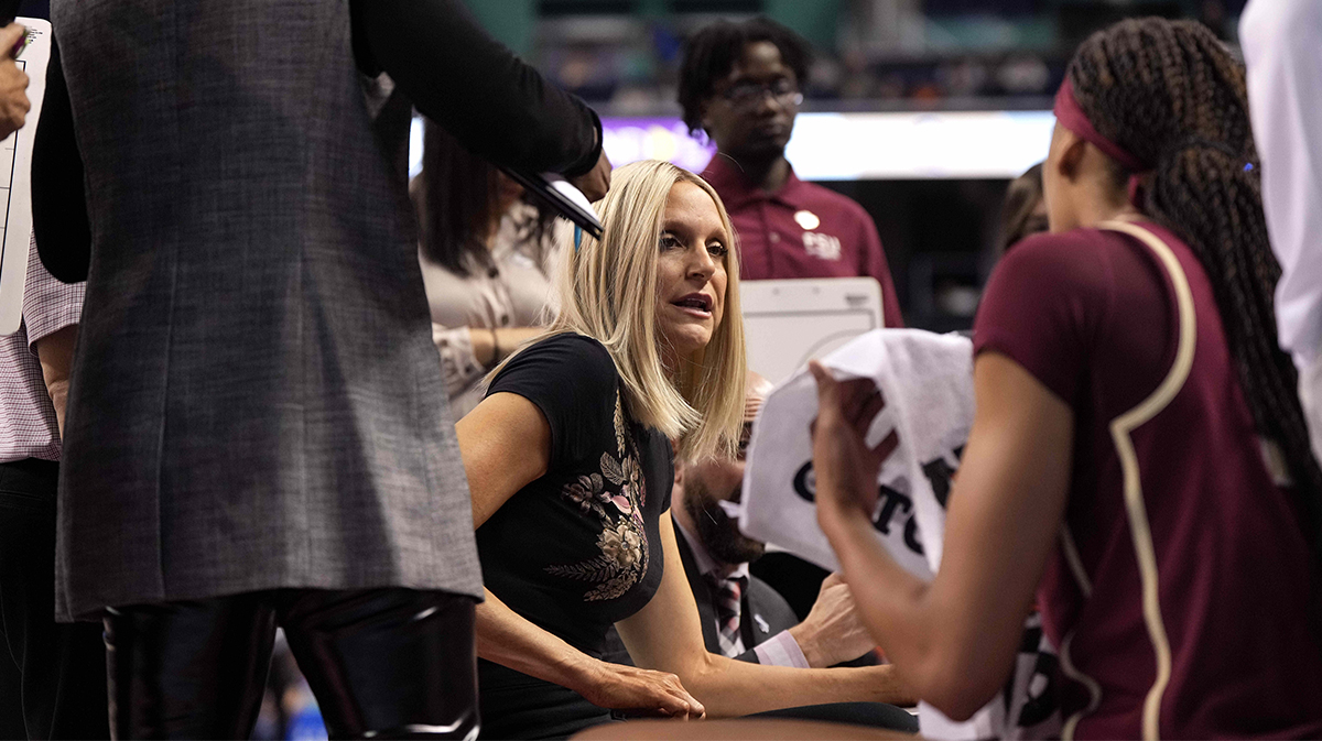 Florida State Seminoles head coach Brooke Wyckoff talks with Florida State Seminoles forward Makayla Timpson (21) during a time out in the first half against the Syracuse Orange.