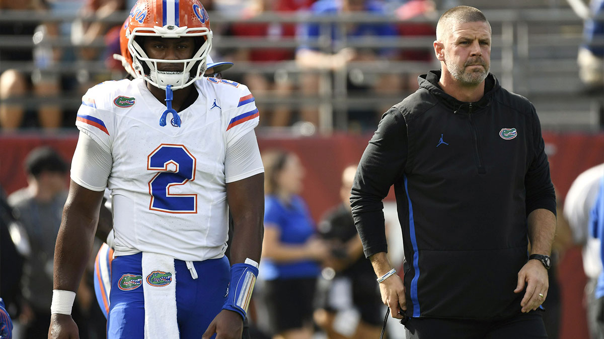 Florida Gators head coach Billy Napier and quarterback DJ Lagway (2) before a game against the Georgia Bulldogs at EverBank Stadium.
