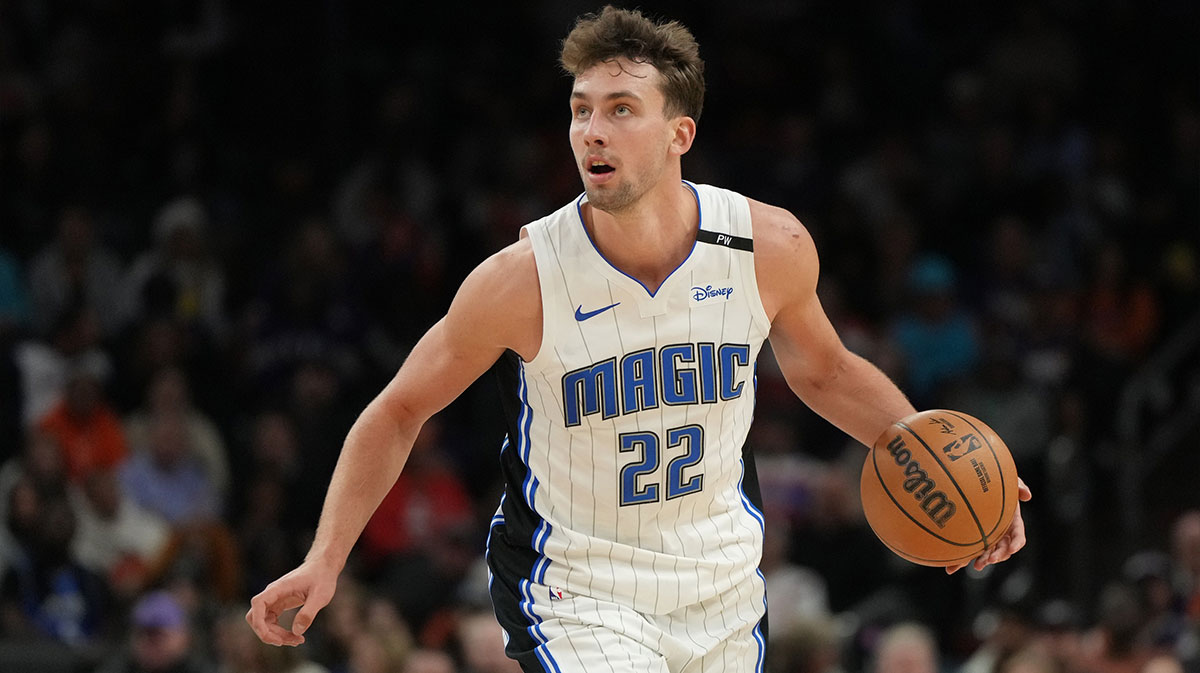 Orlando Magic forward Franz Wagner (22) dribbles the ball against the Phoenix Suns during the second half of an NBA game at Footprint Center.