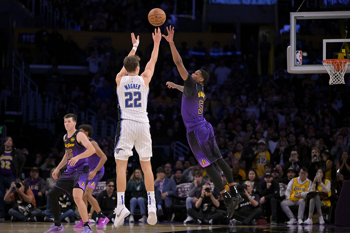 Orlando Magic forward Franz Wagner (22) hits a 3-point basket over Los Angeles Lakers forward Cam Reddish (5) with 2.5 seconds left in the game at Crypto.com Arena.