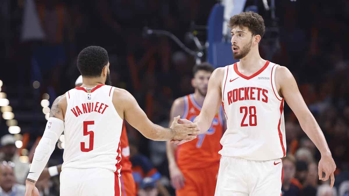 Houston Rockets center Alperen Sengun (28) and guard Fred VanVleet (5) high five after a play against the Oklahoma City Thunder during the first quarter at Paycom Center.