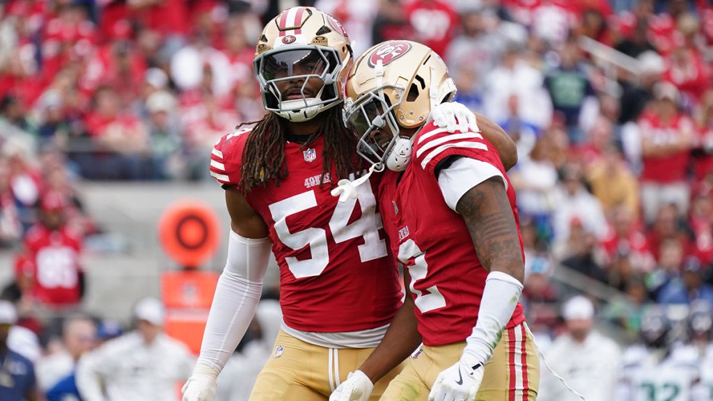 San Francisco 49ers linebacker Fred Warner (54) calms down San Francisco 49ers cornerback Deommodore Lenoir (2) after offsetting penalties against the Seattle Seahawks in the second quarter at Levi's Stadium. 