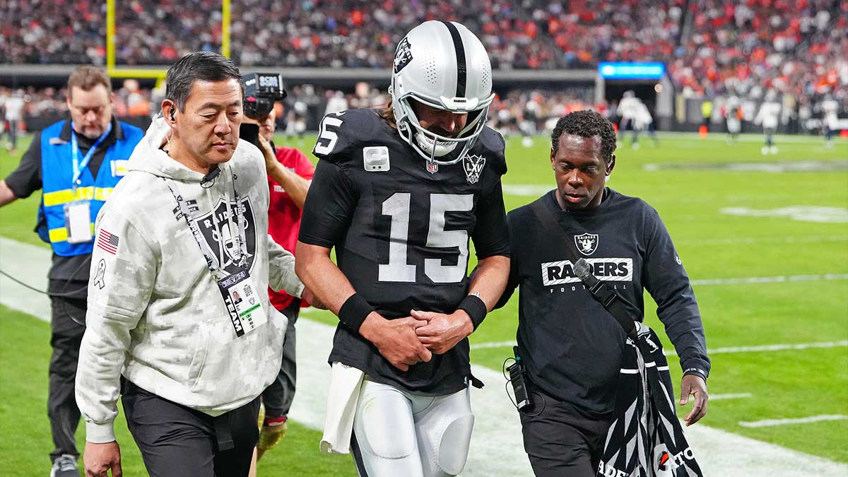 Las Vegas Raiders quarterback Gardner Minshew (15) heads for the locker room after sustaining an apparent injury during a play against the Denver Broncos during the fourth quarter at Allegiant Stadium. 