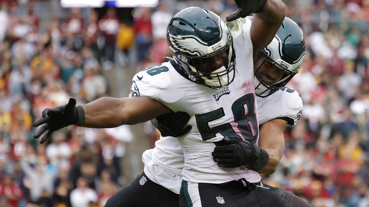Philadelphia Eagles outside linebacker Genard Avery (58) celebrates with Eagles middle linebacker T.J. Edwards (57) after a sack against the Washington Football Team during the third quarter at FedExField.