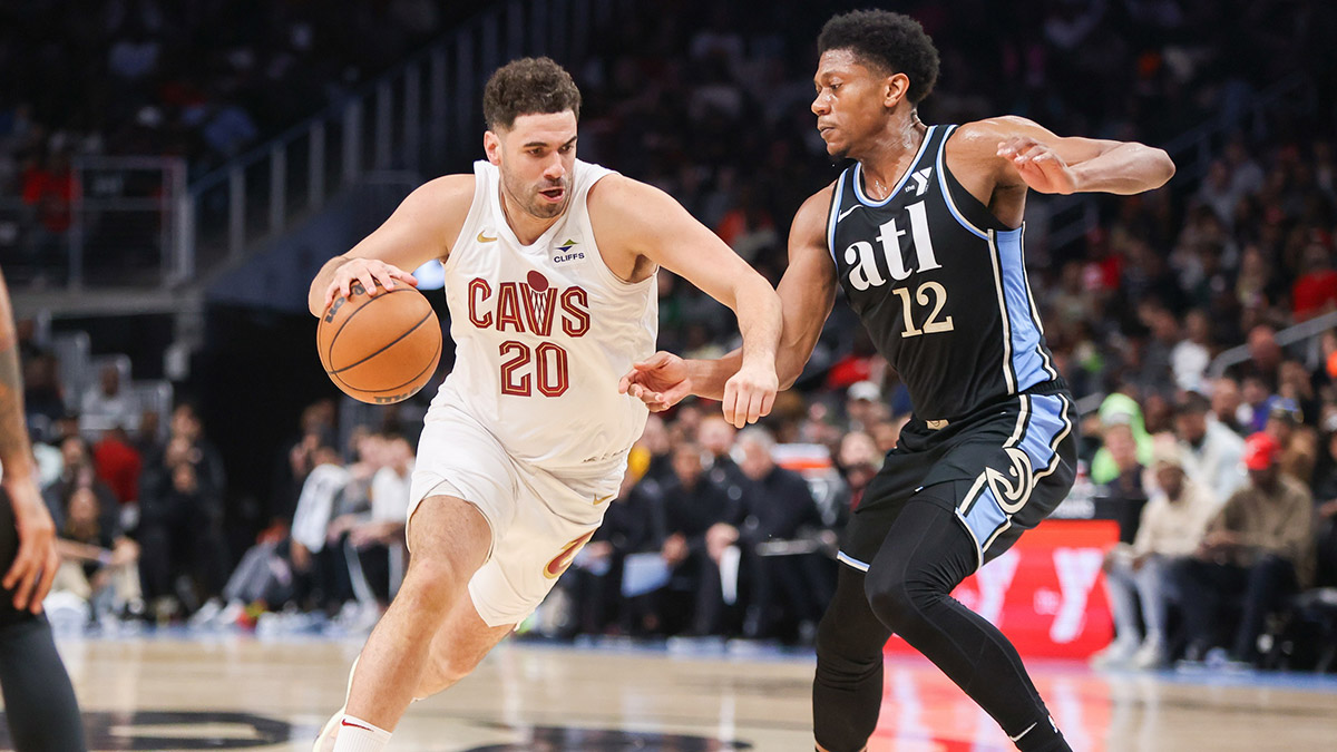 Cleveland Cavaliers forward Georges Niang (20) drives on Atlanta Hawks forward De'Andre Hunter (12) in the second quarter at State Farm Arena.