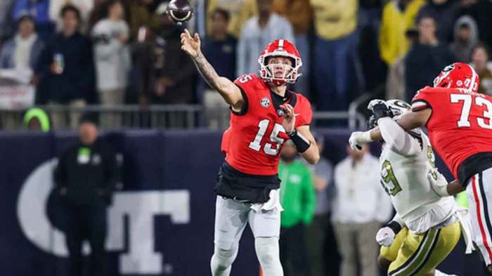 Georgia Bulldogs quarterback Carson Beck (15) throws a pass against the Georgia Tech Yellow Jackets in the second half at Bobby Dodd Stadium at Hyundai Field.