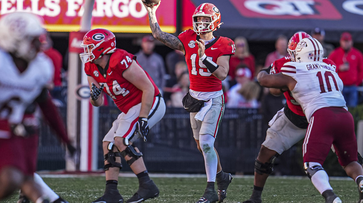 Georgia Bulldogs quarterback Carson Beck (15) passes the ball against the Massachusetts Minutemen during the second half at Sanford Stadium.