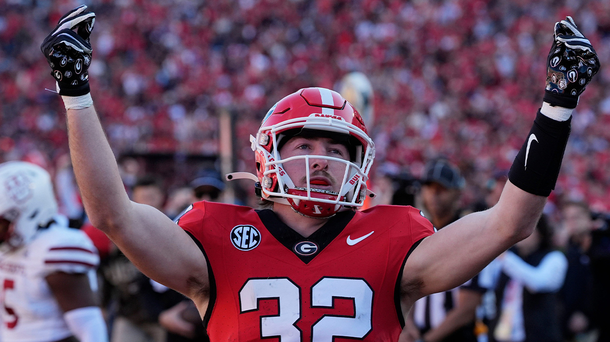Georgia running back Cash Jones (32) celebrates after scoring touchdown during the first half of a NCAA college football game against Massachusetts in Athens, Ga., on Saturday, Nov. 23, 2024.