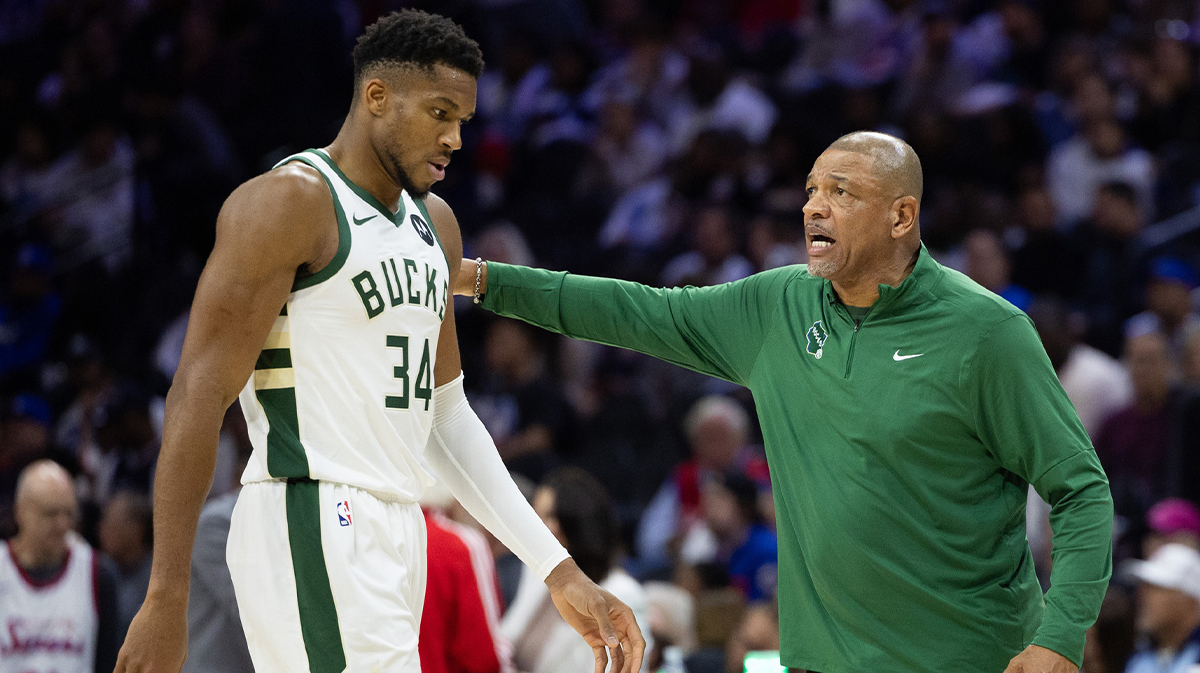 Milwaukee Bucks head coach Doc Rivers talks with forward Giannis Antetokounmpo (34) during the third quarter against the Philadelphia 76ers at Wells Fargo Center. 