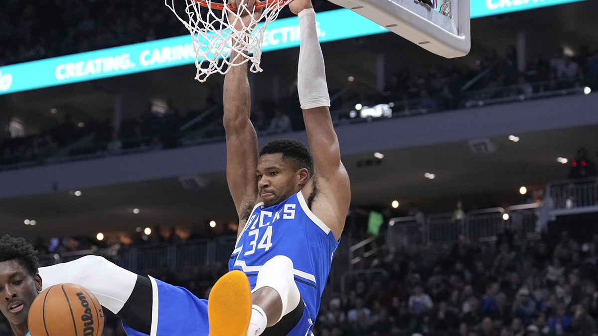 Milwaukee Bucks forward Giannis Antetokounmpo (34) dunks the ball against Charlotte Hornets in the first half at Fiserv Forum.