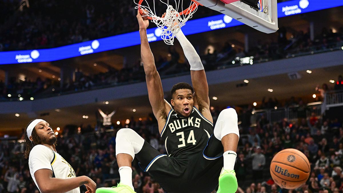 Nov 22, 2024; Milwaukee, Wisconsin, USA; Milwaukee Bucks forward Giannis Antetokounmpo (34) dunks a basket against Indiana Pacers center Myles Turner (33)) in the fourth quarter at Fiserv Forum. Mandatory Credit: Benny Sieu-Imagn Images