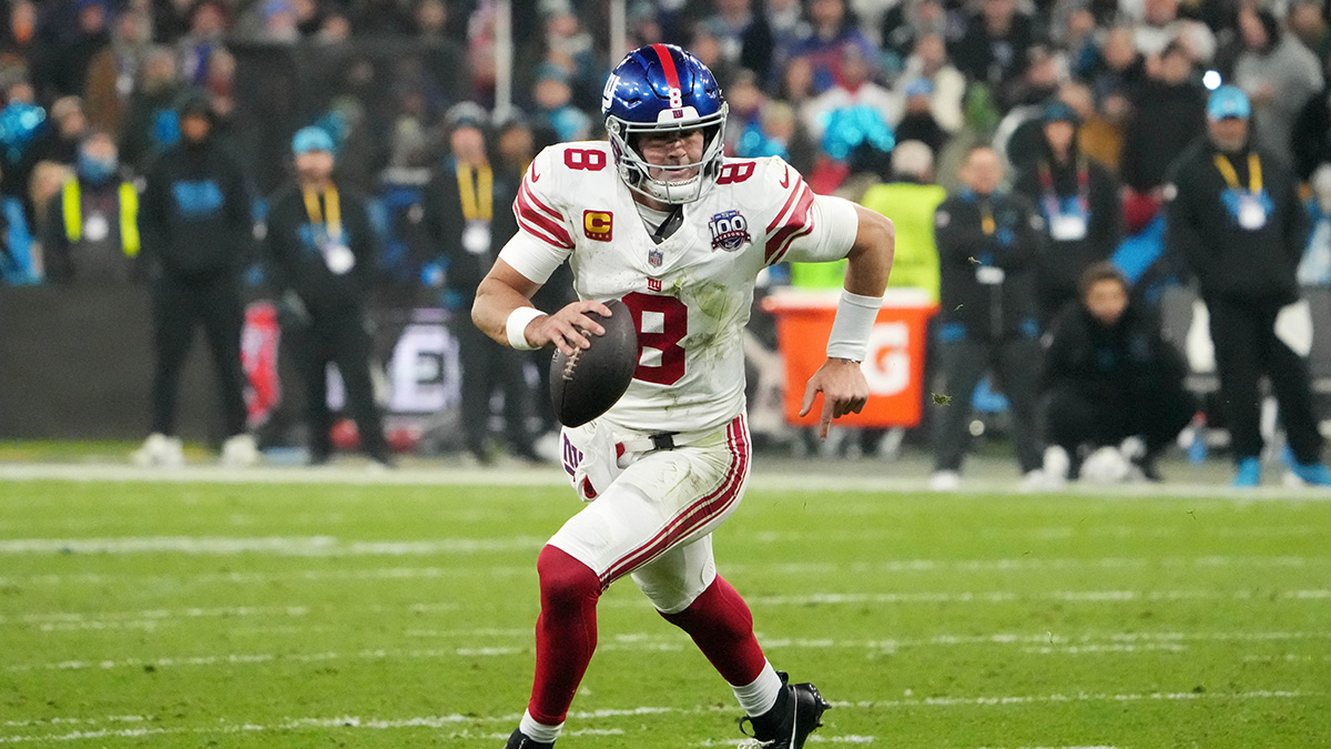 New York Giants quarterback Daniel Jones (8) carries the ball against the New York Giants in the second half during the 2024 NFL Munich Game at Allianz Arena.