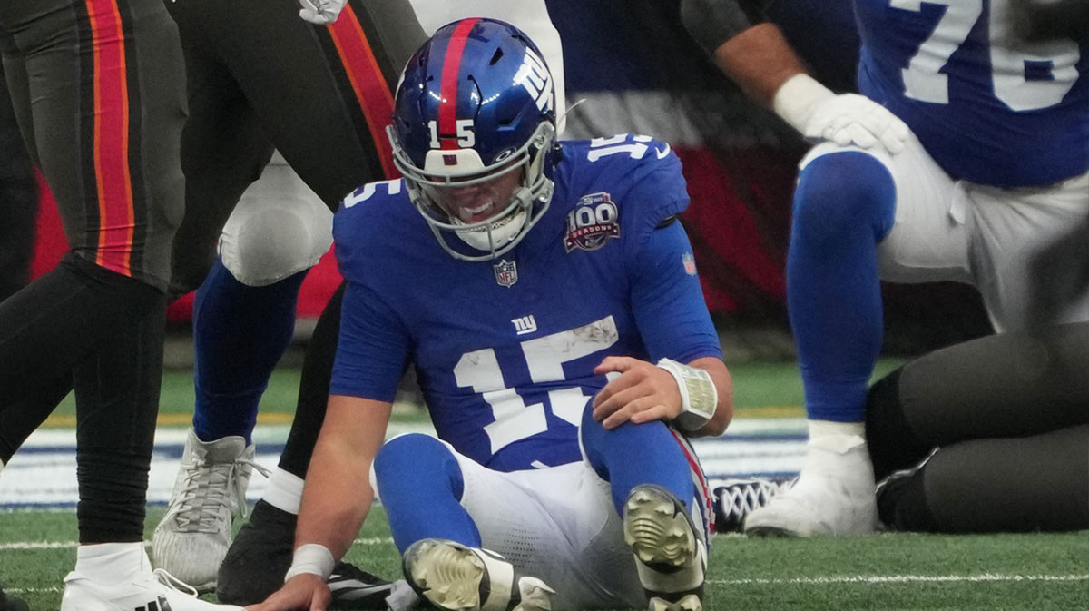 New York Giants quarterback Tommy DeVito (15) after a hard hit from Tampa Bay Buccaneers during the fourth quarter at MetLife Stadium.