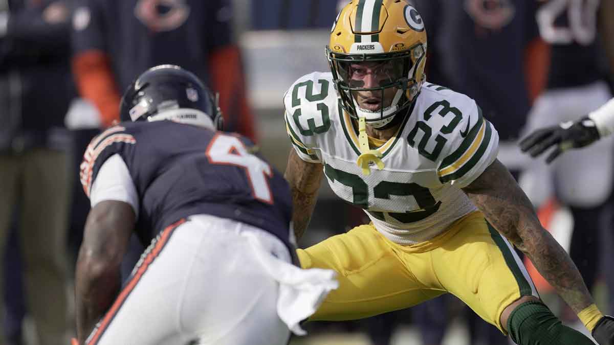 Green Bay Packers cornerback Jaire Alexander (23) tackles Chicago Bears running back D'Andre Swift (4) during the first quarter of their game Sunday, November 17, 2024 at Soldier Field in Chicago, Illinois.