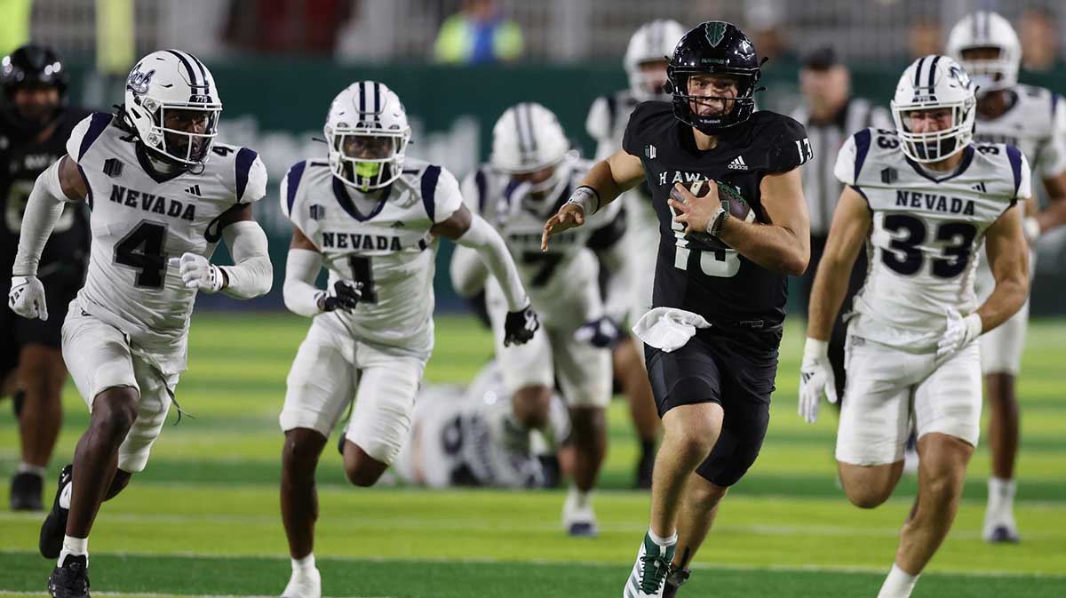 The Nevada Wolfpack defense chases down Hawaii Rainbow Warriors quarterback Brayden Schager (13) during the fourth quarter at the Clarence T.C. Ching Athletics Complex.