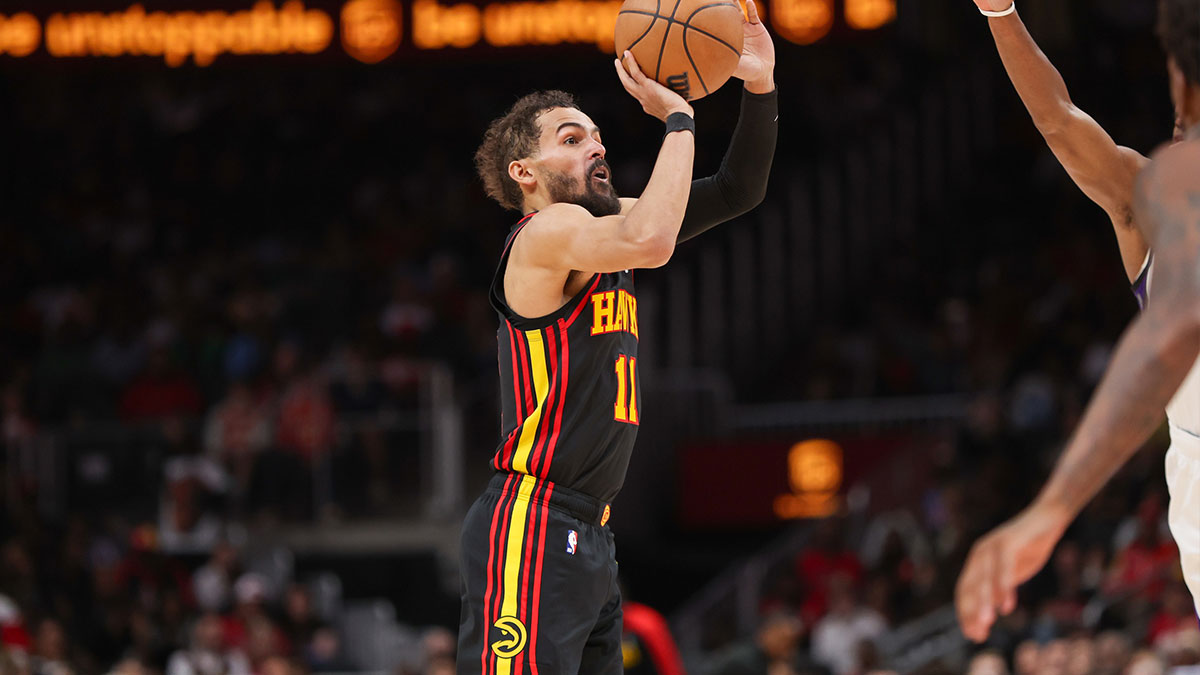 Atlanta Hawks guard Trae Young (11) shoots against the Sacramento Kings in the third quarter at State Farm Arena.
