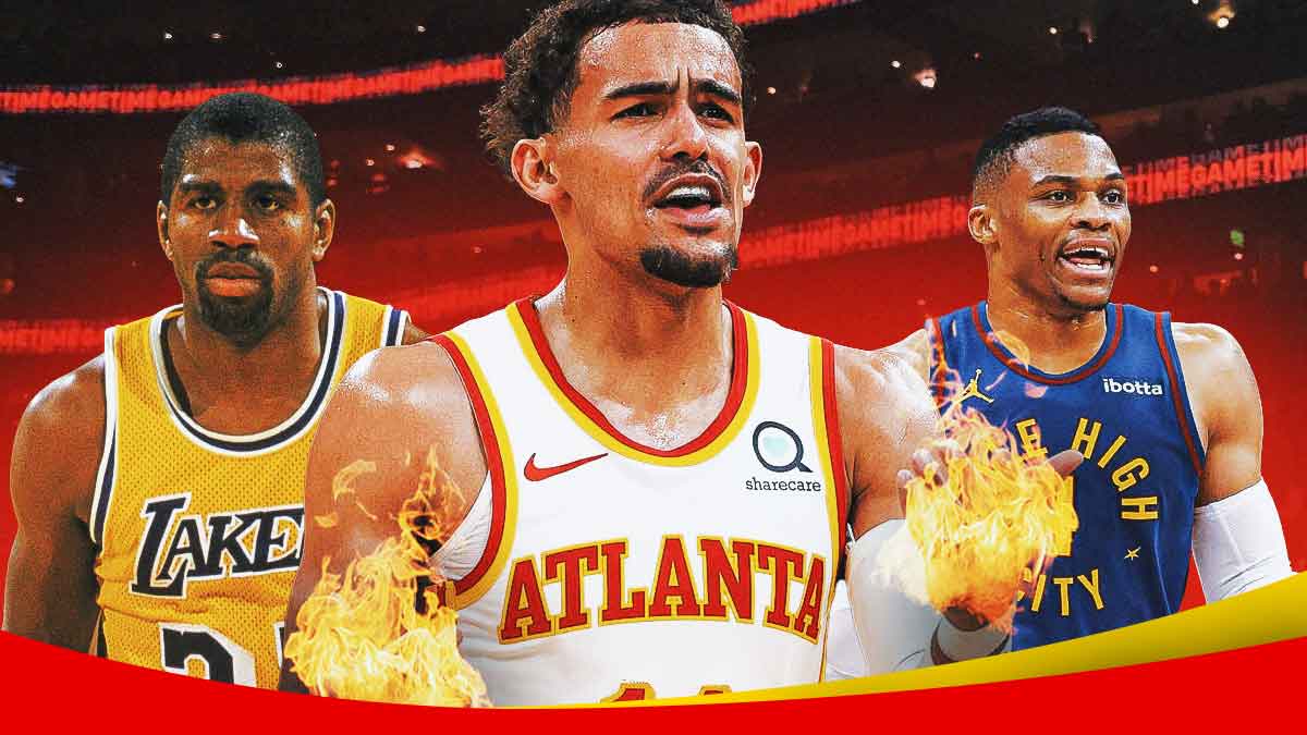 trae young with hands on fire