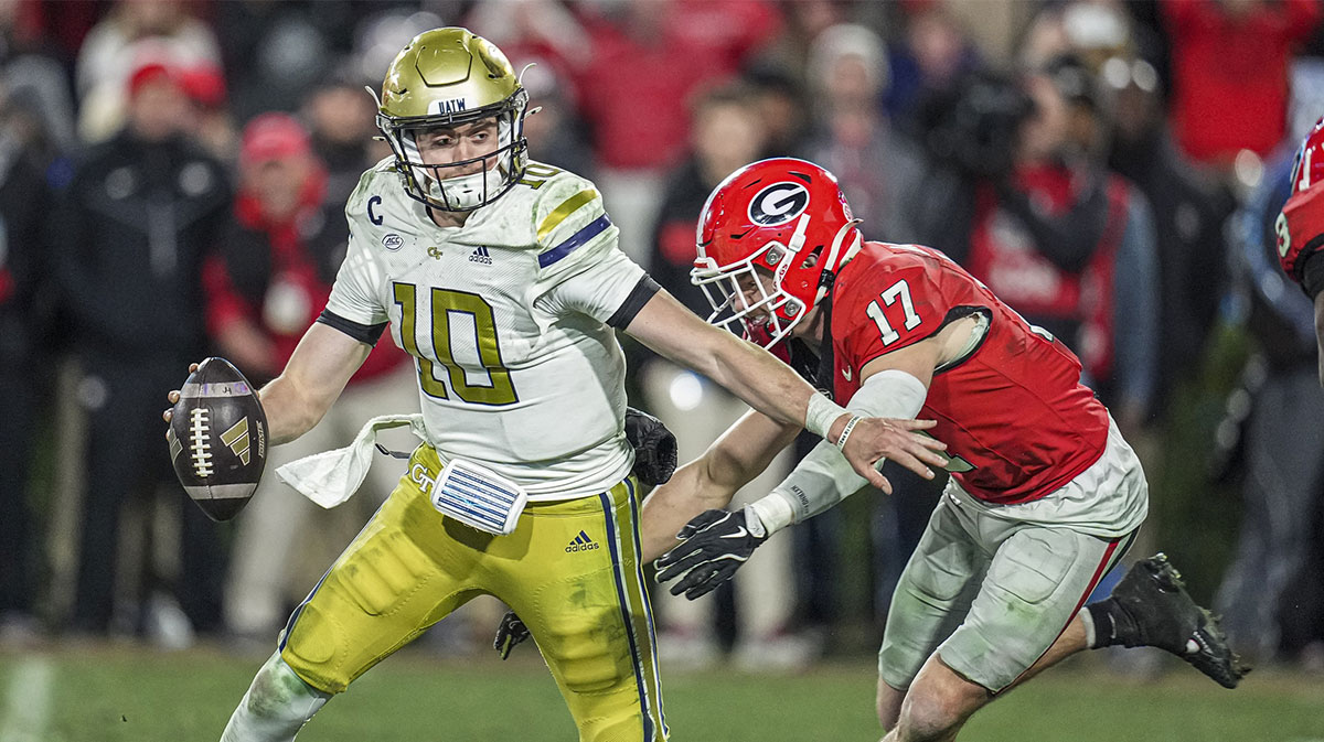Georgia Bulldogs defensive back Dan Jackson (17) sacks Georgia Tech Yellow Jackets quarterback Haynes King (10) during overtime at Sanford Stadium.